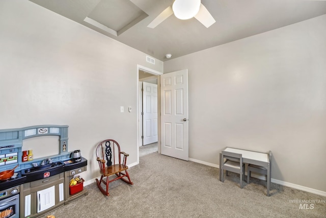 recreation room with light colored carpet and ceiling fan