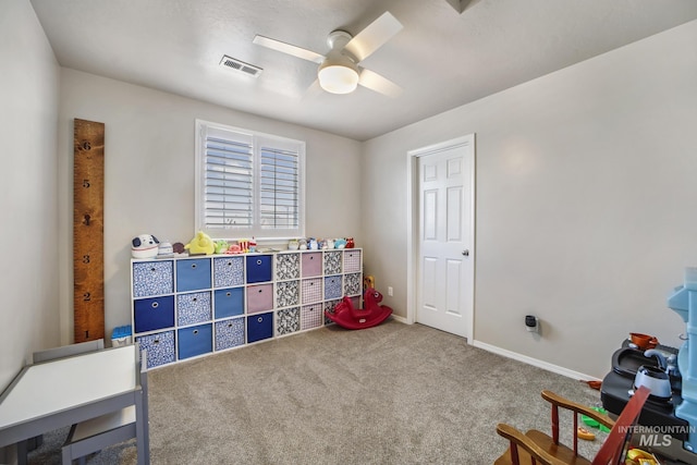 playroom with carpet floors and ceiling fan