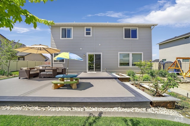 rear view of house featuring an outdoor hangout area and a wooden deck