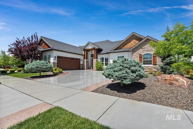 1552 W Windbreaker Ln, Eagle, ID 83616 - view of front of property with stone siding, a garage, and concrete driveway