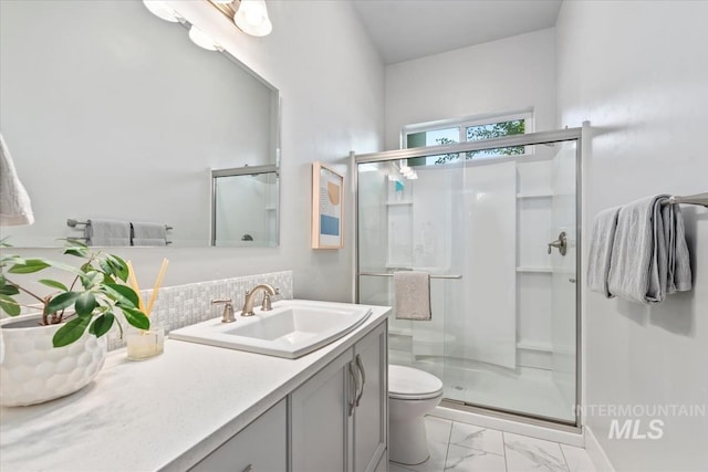 1552 W Windbreaker Ln, Eagle, ID 83616 - bathroom with marble finish flooring, vanity, a stall shower, toilet, and decorative backsplash