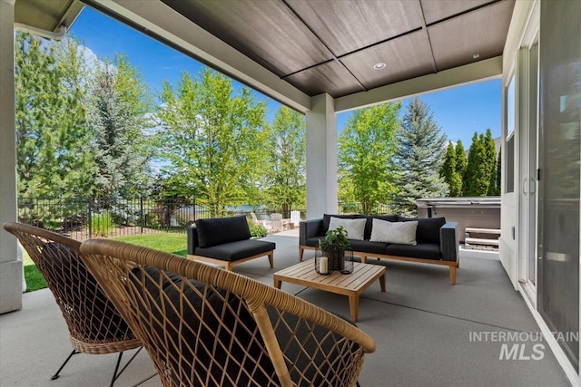1552 W Windbreaker Ln, Eagle, ID 83616 - view of patio featuring an outdoor hangout area and view of scattered trees