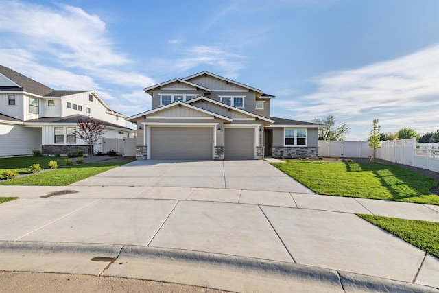 craftsman-style home with stone siding, driveway, board and batten siding, and an attached garage