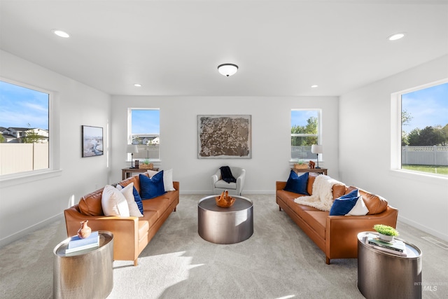 living room featuring carpet floors, recessed lighting, and baseboards