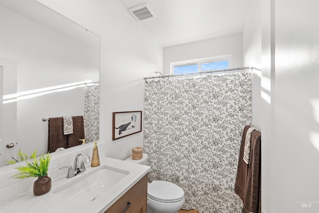 full bathroom with toilet, vanity, and a shower with shower curtain