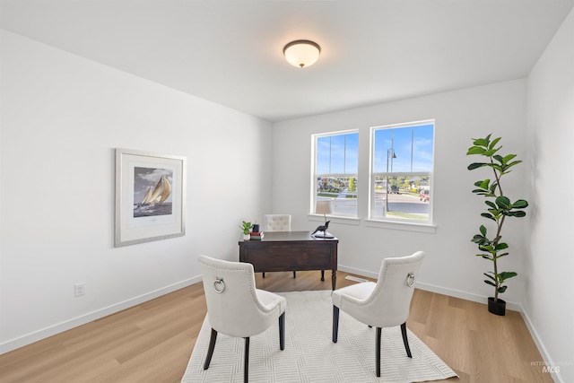home office featuring light wood finished floors and baseboards