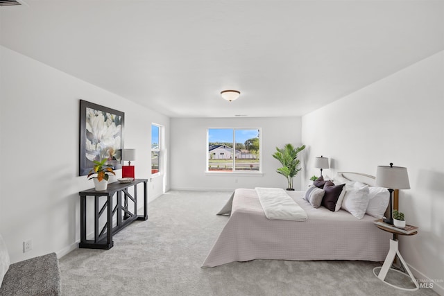 bedroom with carpet floors and baseboards
