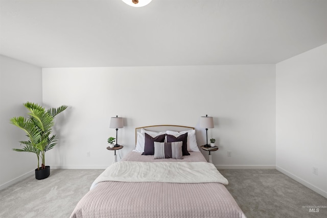 bedroom featuring carpet flooring and baseboards
