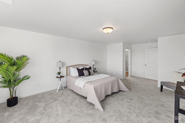 bedroom with carpet and baseboards