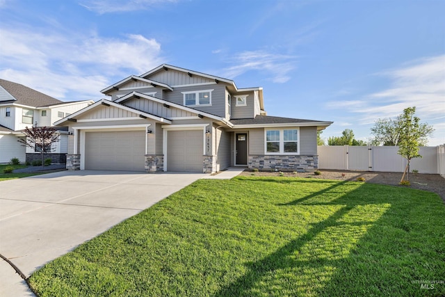 craftsman inspired home with driveway, board and batten siding, stone siding, and a gate