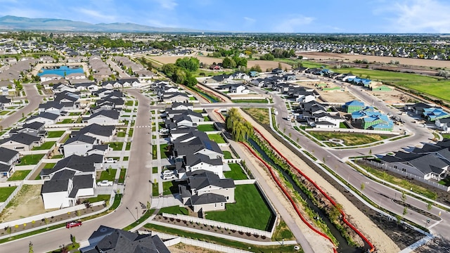 view of property location featuring nearby suburban area and a mountain backdrop