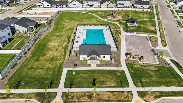 aerial view of residential area with a pool