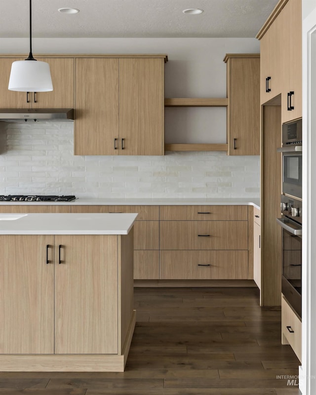 kitchen featuring light countertops, light brown cabinetry, gas cooktop, open shelves, and pendant lighting