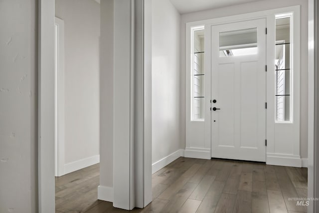 entryway featuring light wood-type flooring and baseboards