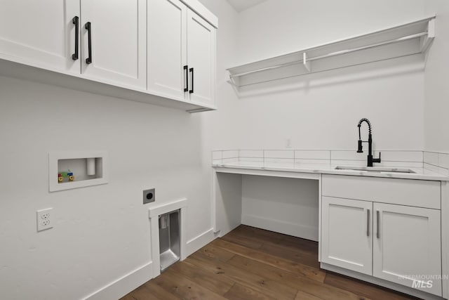 laundry area featuring hookup for an electric dryer, dark hardwood / wood-style flooring, hookup for a washing machine, cabinets, and sink