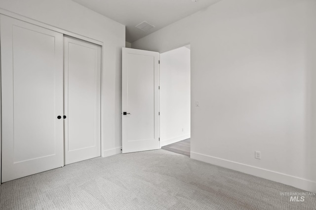 unfurnished bedroom with a closet