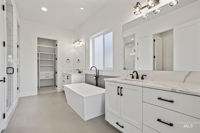 bathroom with separate shower and tub and vanity