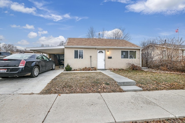 view of front facade with a carport