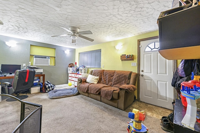 carpeted living room with ceiling fan, cooling unit, and a textured ceiling