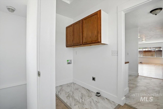 101 E 2nd St, Emmett, ID 83617 - laundry room featuring washer hookup, electric dryer hookup, light marble finish flooring, and cabinet space