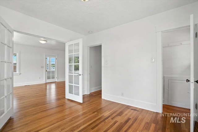 101 E 2nd St, Emmett, ID 83617 - spare room featuring french doors and light wood-type flooring