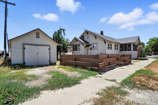 101 E 2nd St, Emmett, ID 83617 - view of front of property featuring a shed, a chimney, and a garage