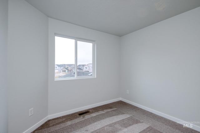 2839 N Rocky Bottom Way, Kuna, ID 83634 - carpeted spare room with baseboards and visible vents