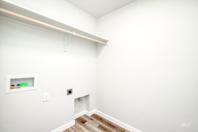 2839 N Rocky Bottom Way, Kuna, ID 83634 - clothes washing area with laundry area, light wood-style flooring, electric dryer hookup, baseboards, and hookup for a washing machine
