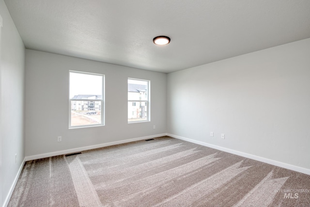 2839 N Rocky Bottom Way, Kuna, ID 83634 - carpeted spare room featuring baseboards and visible vents