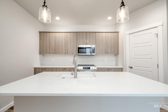 2839 N Rocky Bottom Way, Kuna, ID 83634 - kitchen with modern cabinets, stainless steel appliances, decorative backsplash, and a sink