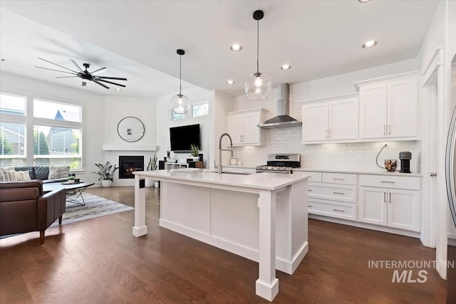 3023 E Tusa St, Meridian, ID 83642 - kitchen with wall chimney range hood, electric range, open floor plan, a sink, and light countertops