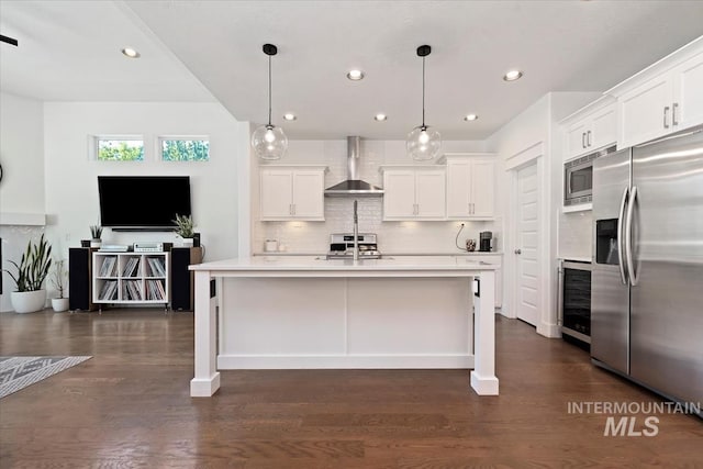 3023 E Tusa St, Meridian, ID 83642 - kitchen featuring appliances with stainless steel finishes, wall chimney exhaust hood, wine cooler, light countertops, and recessed lighting
