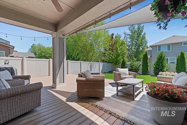 3023 E Tusa St, Meridian, ID 83642 - wooden deck with a fenced backyard, a ceiling fan, and outdoor lounge area