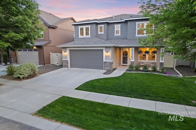 3023 E Tusa St, Meridian, ID 83642 - view of front of home with a garage, concrete driveway, stone siding, and a shingled roof