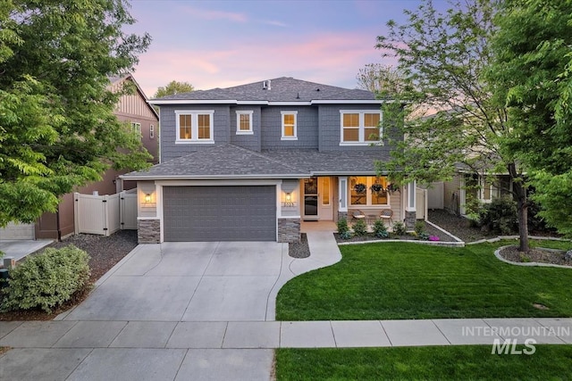 3023 E Tusa St, Meridian, ID 83642 - view of front facade featuring concrete driveway, a garage, stone siding, a shingled roof, and a porch