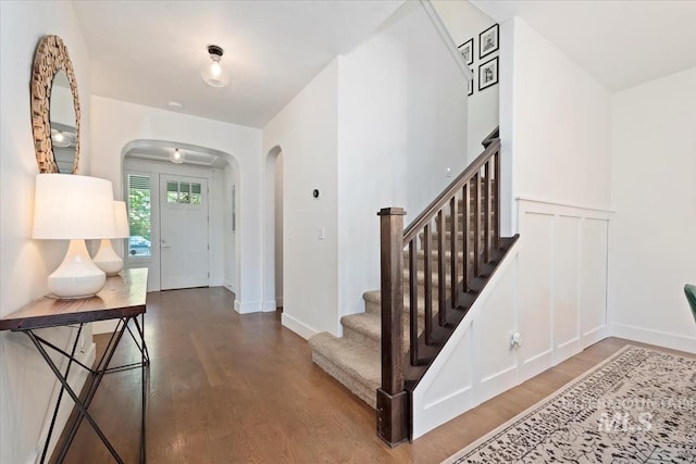 3023 E Tusa St, Meridian, ID 83642 - foyer featuring arched walkways, wood finished floors, stairs, and baseboards