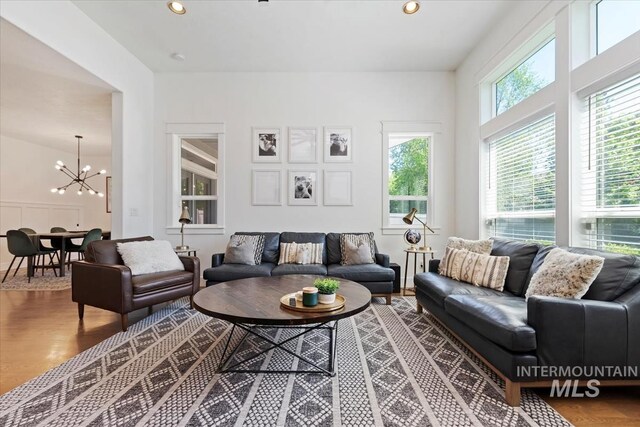 3023 E Tusa St, Meridian, ID 83642 - living room featuring a chandelier, wood finished floors, and recessed lighting