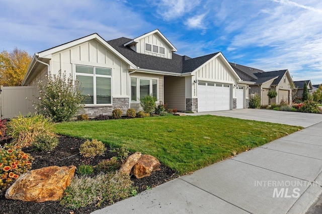 craftsman-style home with a front lawn and a garage