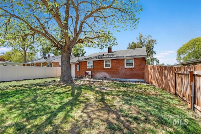 904 N 9th Ave, Buhl, ID 83316 - back of house featuring brick siding and a chimney