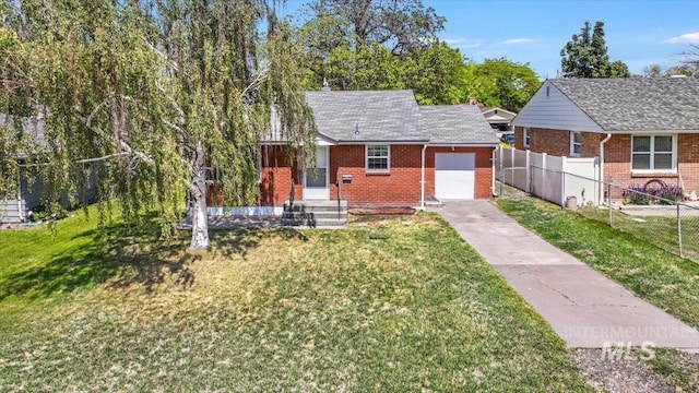 904 N 9th Ave, Buhl, ID 83316 - view of front of house featuring concrete driveway, brick siding, and an attached garage