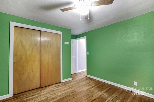 904 N 9th Ave, Buhl, ID 83316 - unfurnished bedroom featuring wood finished floors, baseboards, and a closet