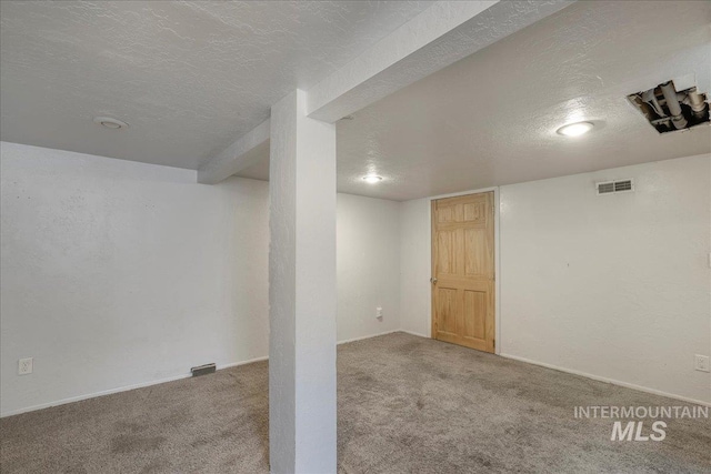 904 N 9th Ave, Buhl, ID 83316 - finished basement featuring a textured ceiling, carpet, and baseboards
