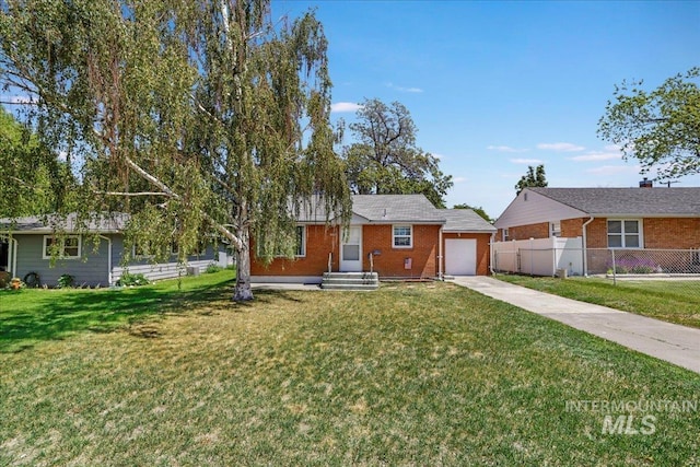 904 N 9th Ave, Buhl, ID 83316 - single story home featuring concrete driveway, brick siding, and an attached garage