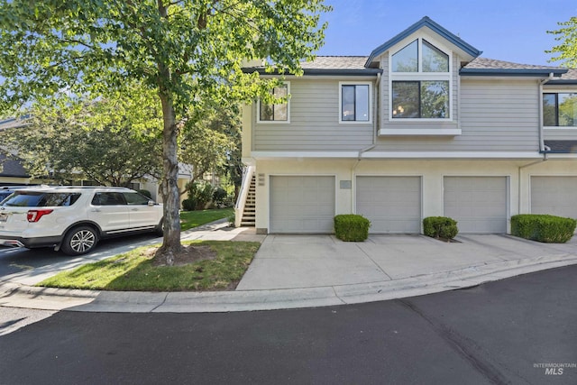 964 E Riverpark Ln, Boise, ID 83706 - multi unit property featuring an attached garage, concrete driveway, and a shingled roof