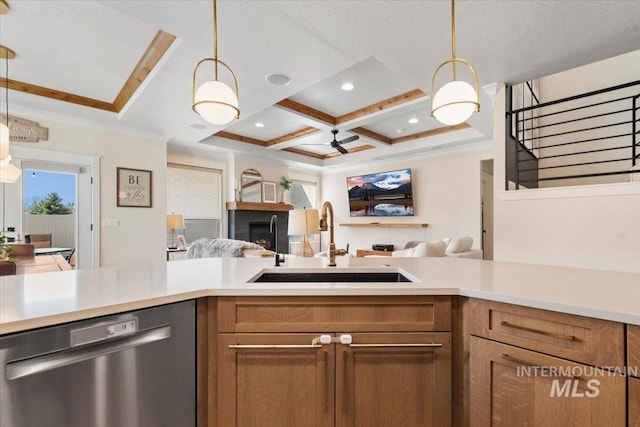 kitchen with open floor plan, dishwasher, light countertops, coffered ceiling, and a sink