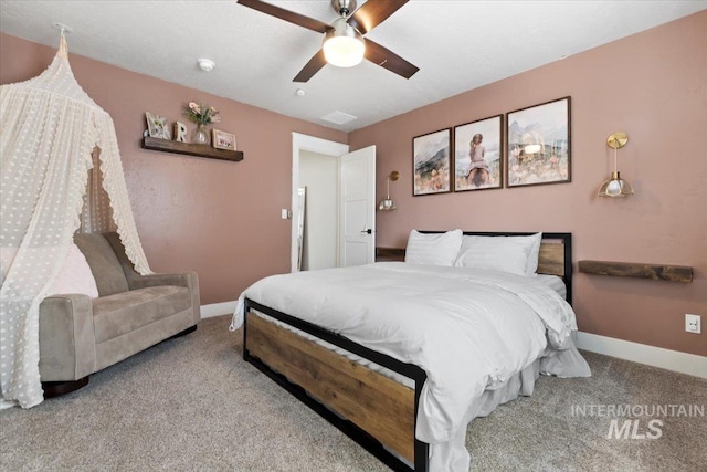 carpeted bedroom featuring a ceiling fan and baseboards