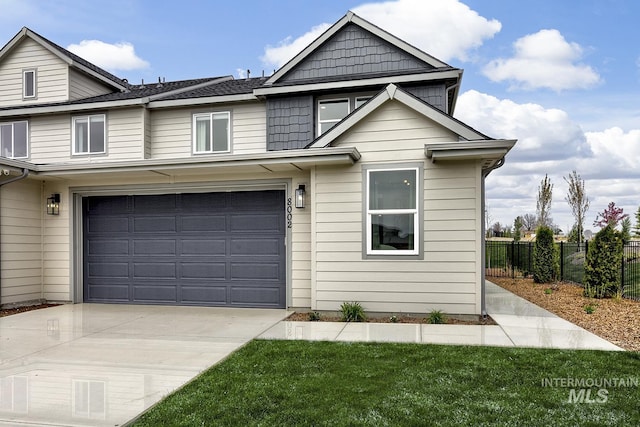 8002 W Fern St, Eagle, ID 83616 - view of front of property featuring an attached garage and driveway