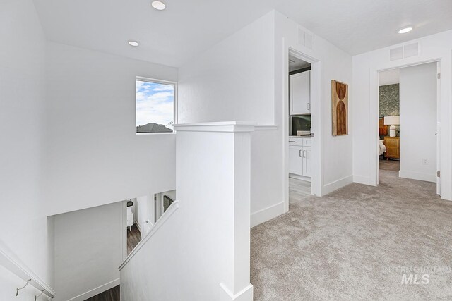 8002 W Fern St, Eagle, ID 83616 - corridor featuring carpet flooring, baseboards, an upstairs landing, and recessed lighting