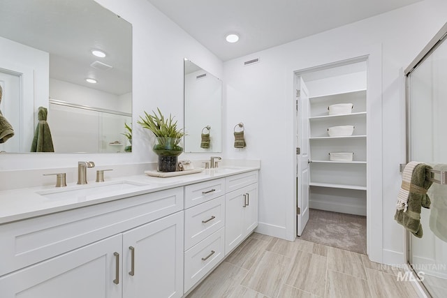 8002 W Fern St, Eagle, ID 83616 - full bath featuring a shower stall, double vanity, baseboards, a spacious closet, and recessed lighting