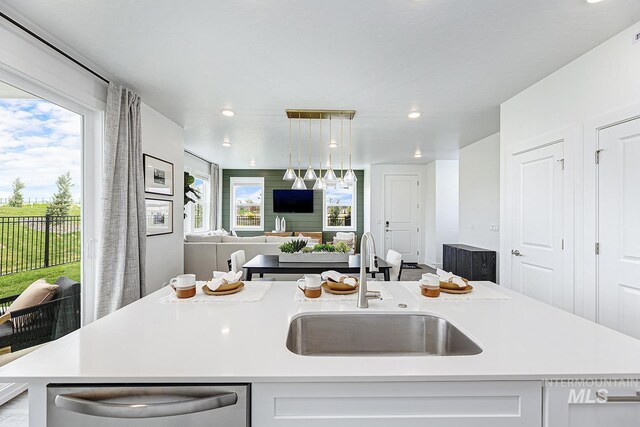 8002 W Fern St, Eagle, ID 83616 - kitchen featuring a sink, dishwasher, open floor plan, light countertops, and recessed lighting